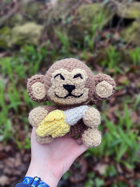 Monkey holding a banana