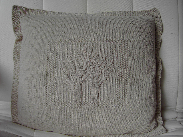Cushion knitted with cable tree patterning