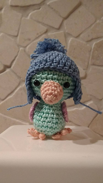 Mini mutsje met oorflappen