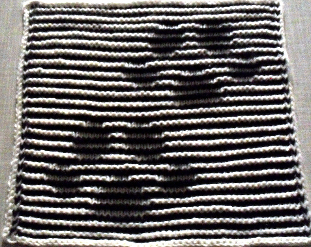 Pfotenabdruck Katze in Schattenstricktechnik