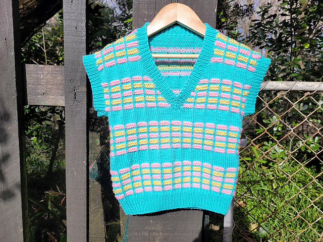 Childs v-neck vest with slipped stitch stripes