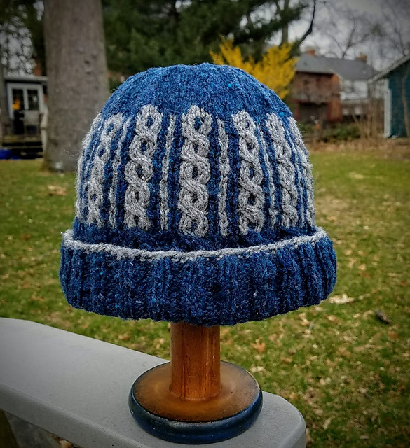 Ravelry: Two Color Cable Cap pattern by David Assemany