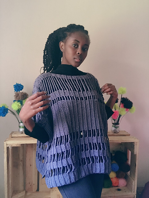 Distressed poncho sweater