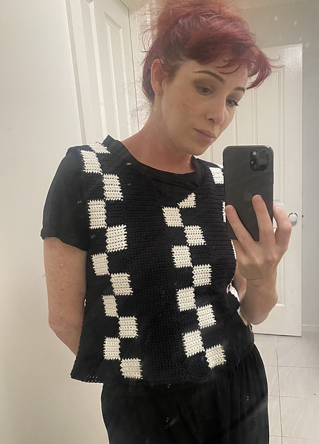 Wednesday’s black&white checkerboard vest