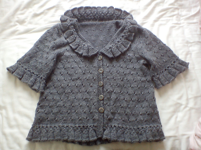 Lacy sweater with ruffled edges