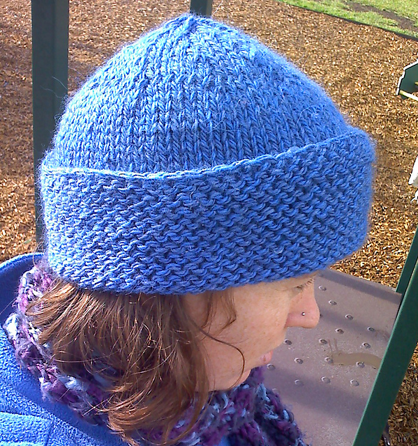 Fitted hat with roll back brim