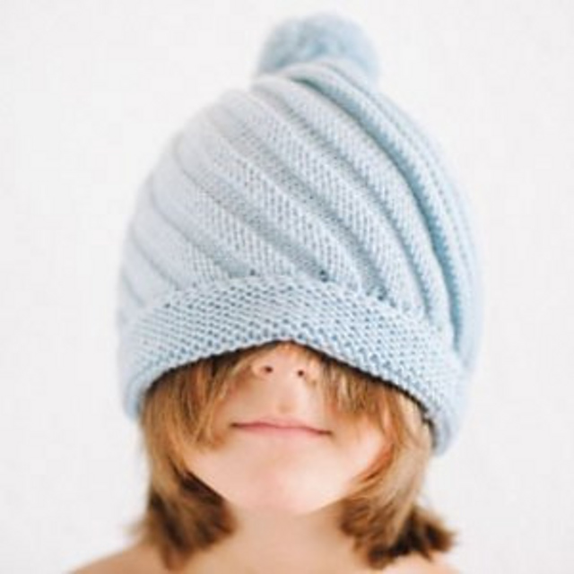 Diagonal Rib Swirl Beanie with PomPom