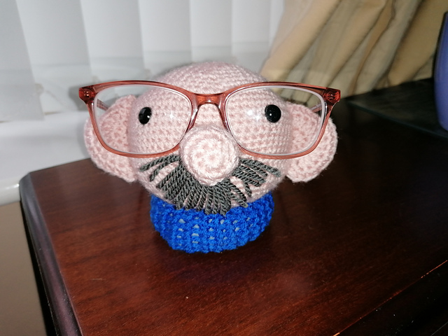 Bald man glasses holder