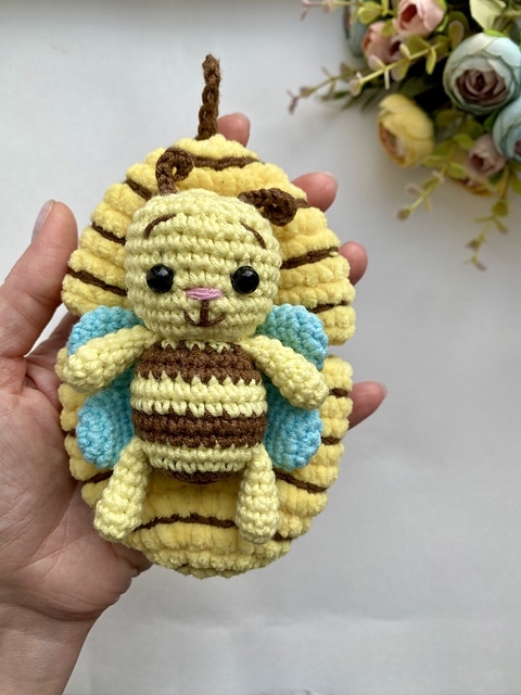 Honey bee in plush beehive