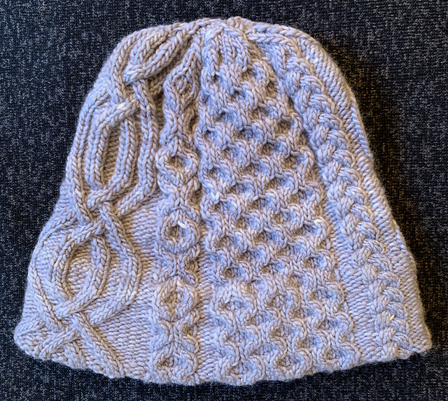 Ravelry: Built-In Brim Cable Hat pattern by Jim Furr