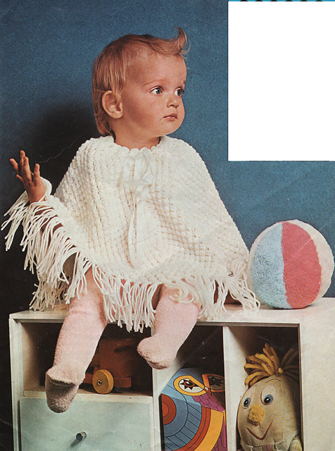 Baby takes to a poncho