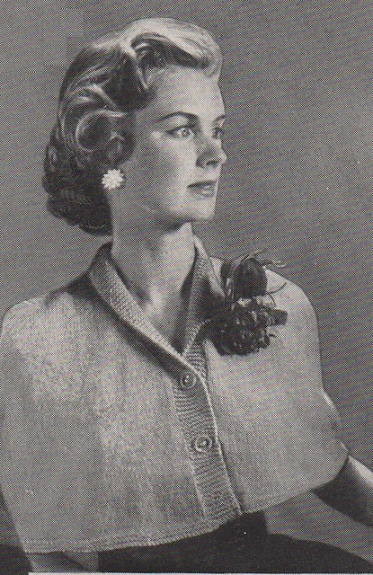 Cape with roll collar