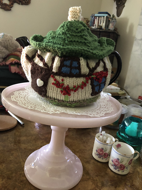 Festive cottage tea cosies