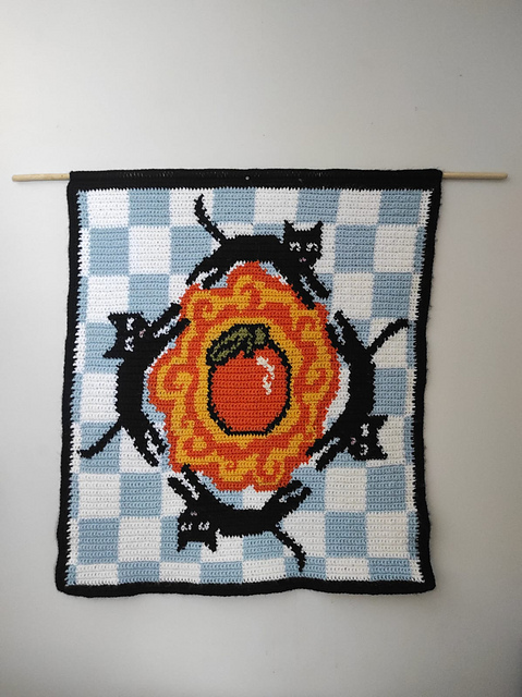 Cats Running Around an Orange Tapestry