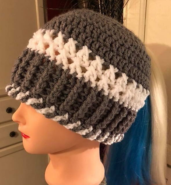 Tail Hanging Out the Back with a Twist Hat
