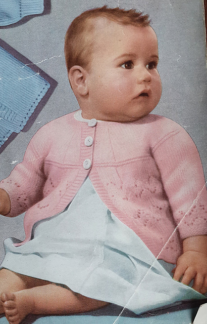 First size matinee jacket with round yoke