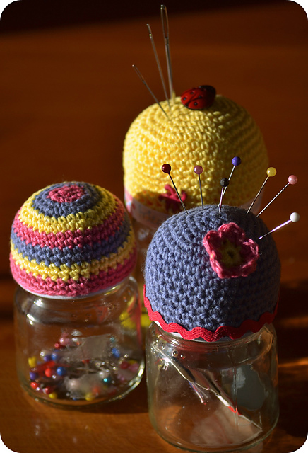 Pin cushion on top of a jar