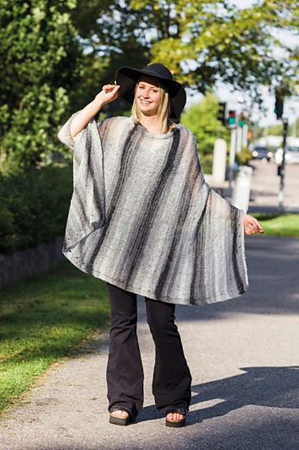 91645. GLITTRIG PONCHO/AXELVÄRMARE