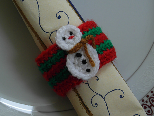 Snowman takes a hold napkin ring