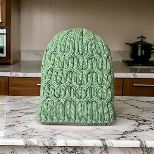 Ravelry: Evergreen Twisted Cable Hat pattern by Sunayana Negi