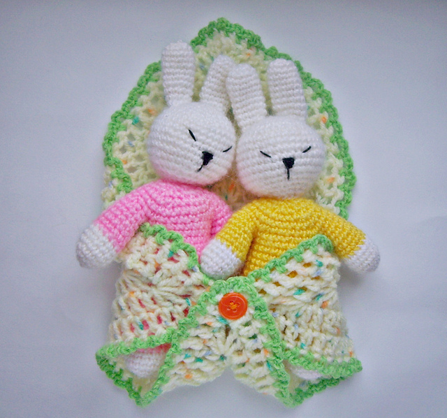 Little sleepy baby rabbits in sleeping bag