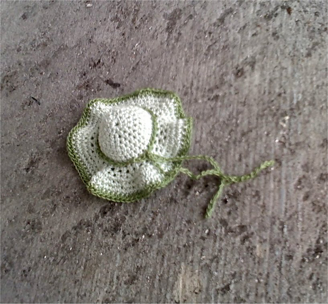 miniature hat with ribbon