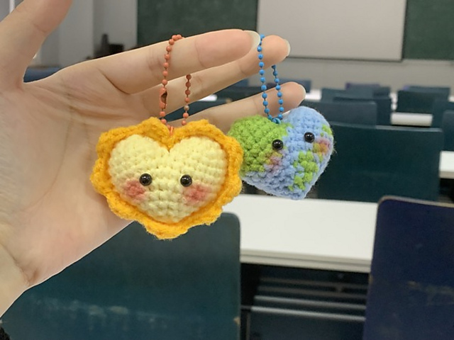 Earth and sun keychains couple