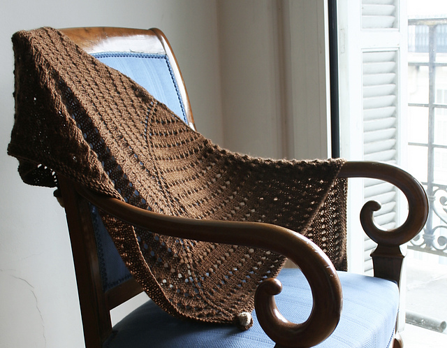 Lacy textured shawl with acorns
