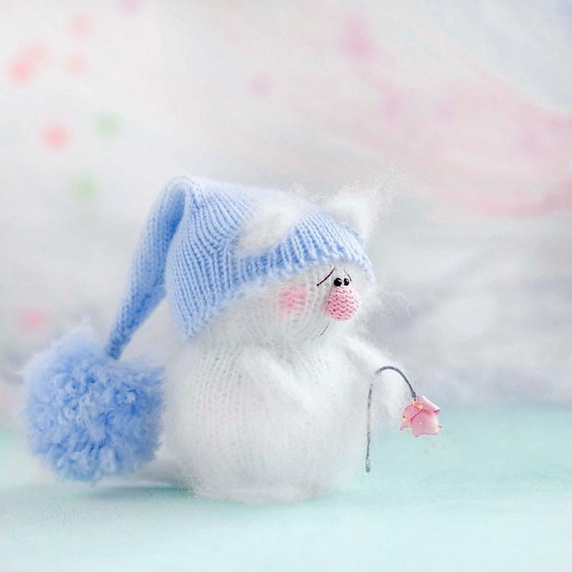 White cat with flower