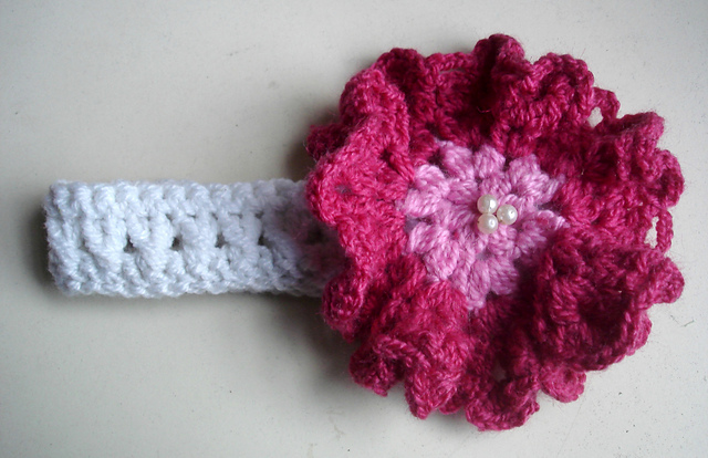 Headband with large ruffle flower