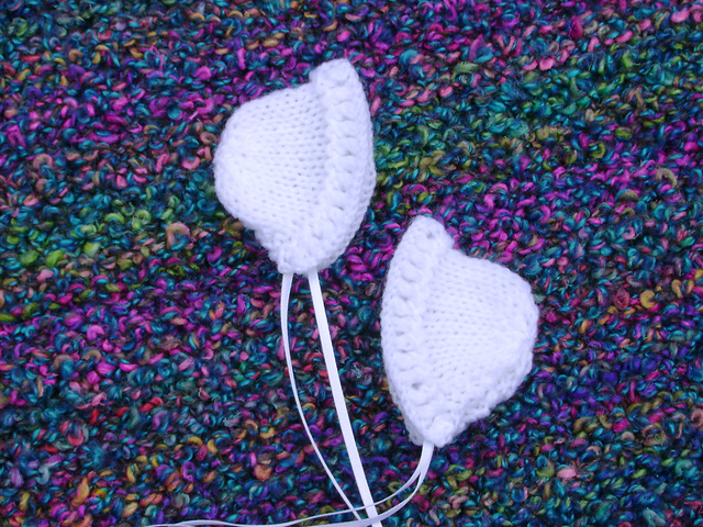 Tiny Knitted Bonnet With Eyelet Brim