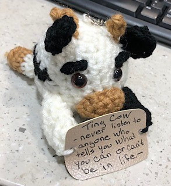 Caring cow sign holder