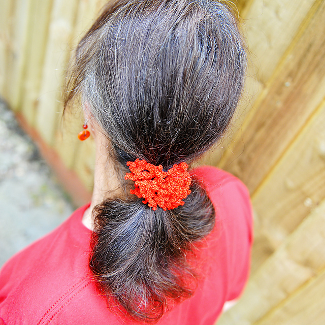 Curly coral scrunchie hair tie