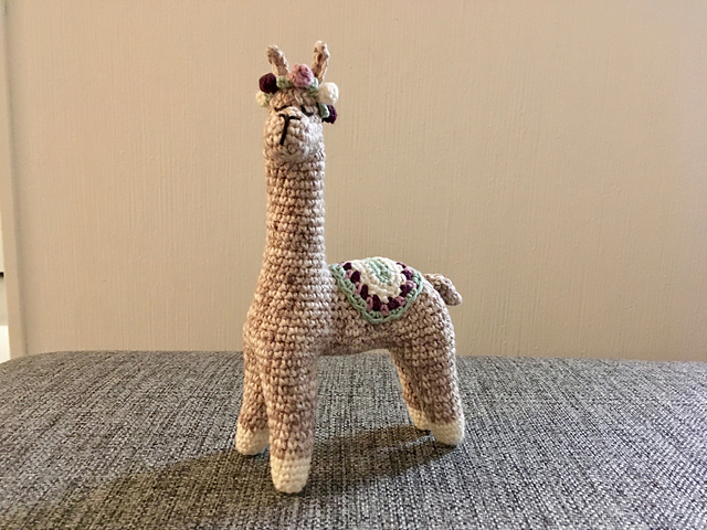 Llama alpaca with rose crown