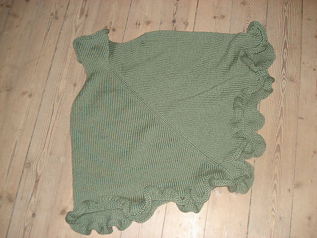 Poncho med flæsekant