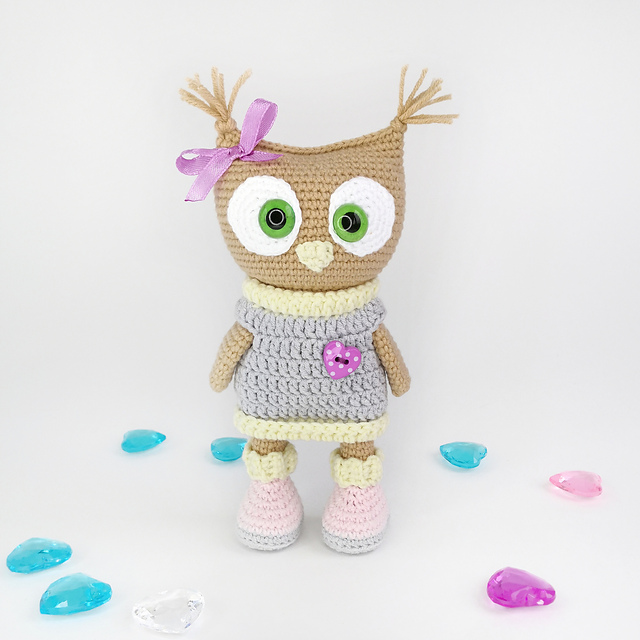 Cute owl in sweater