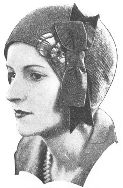 Daintily-shaped cap to wear with tweeds
