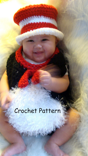476 infant black cat wearing a red and white hat