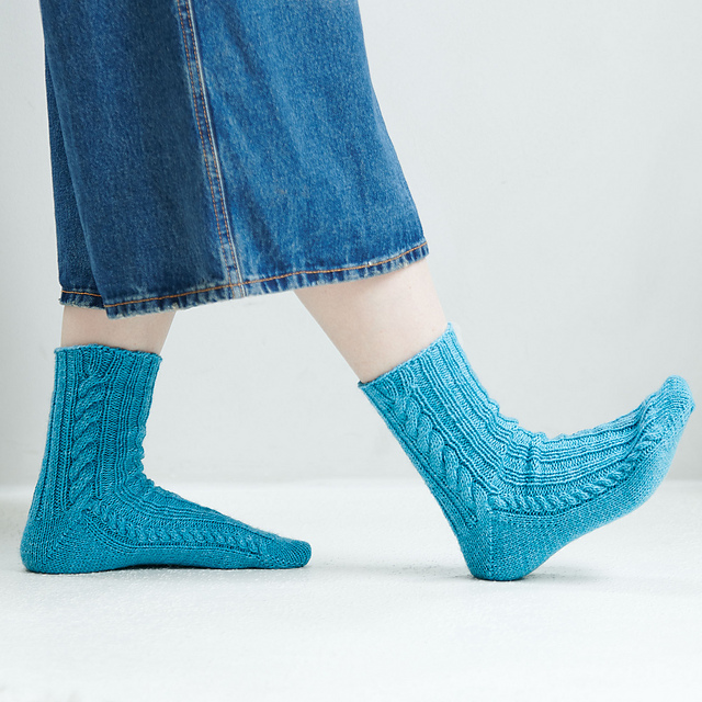 Ravelry: Toe-up Cabled Socks pattern by Nicole Winer