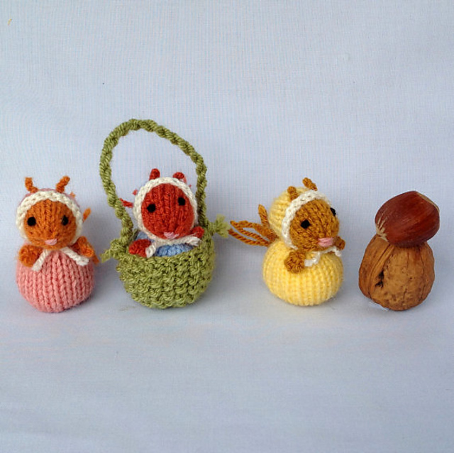 Tiny squirrel in acorn cup basket