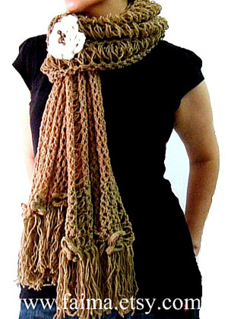 chunky shawl with fringe and floral brooch