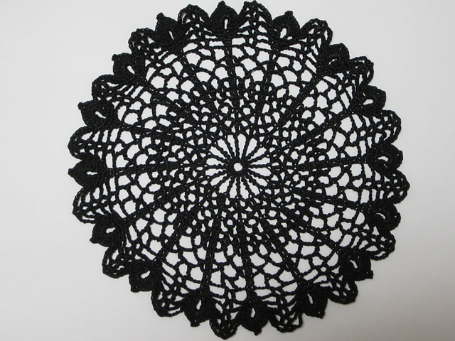 Large flower with a butterfly fluttering doily