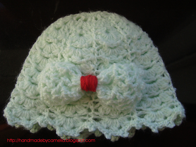Crocheted baby hat with a bow