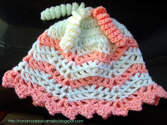 Crocheted Baby Hat with Curly Tassels
