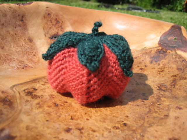 crochet ball or pincushion shaped like an orange