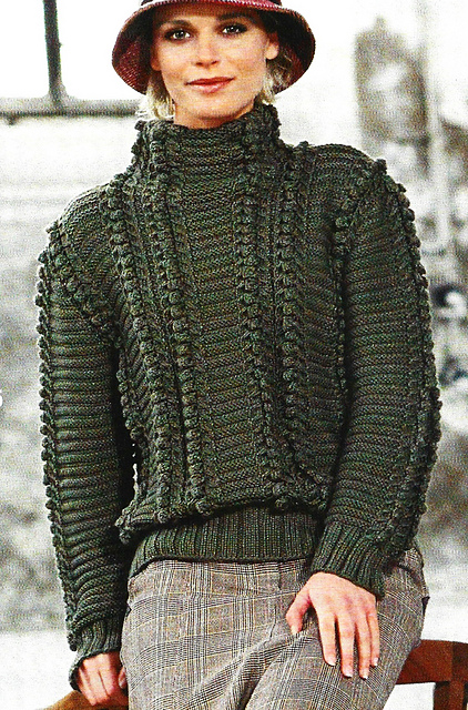 # 25 Pull vert gazon en motif à noppes