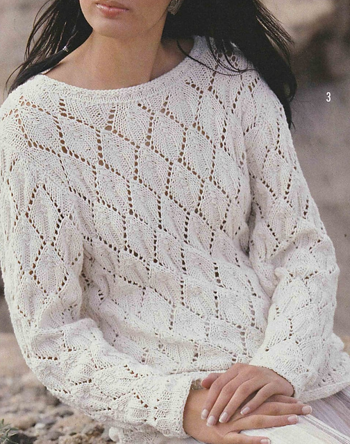 # 03 Pull écru à motifs divers