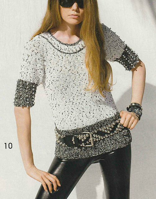 # 10 Pull noir et blanc avec perles argentées