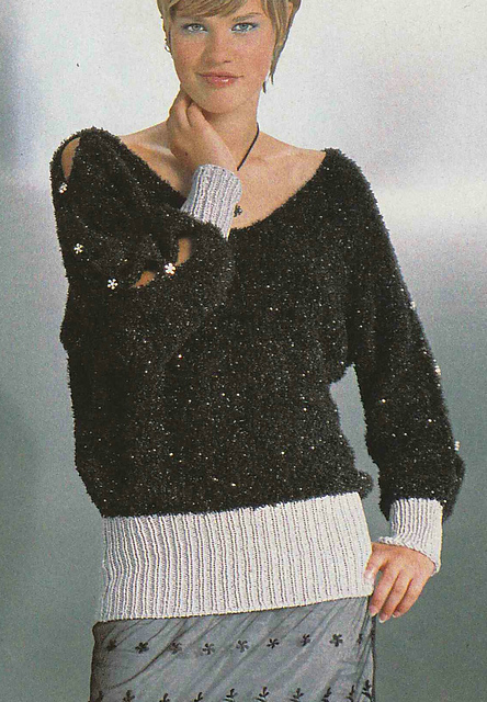 # 12 Buttoned Sleeve Sweater in Black and Silver