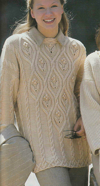 # 08 Pull à motifs en crème